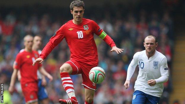 Wales midfield Aaron Ramsey in action against England in 2012