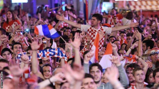 Croatia fans celebrate their semi-final victory over England on the streets of Zagreb