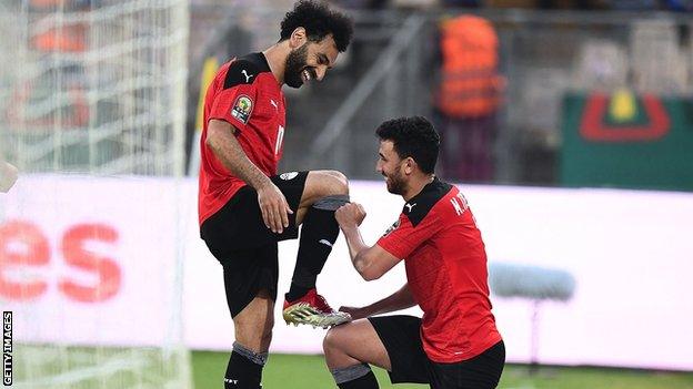 Mohamed Salah and Trezeguet celebrate a goal for Egypt