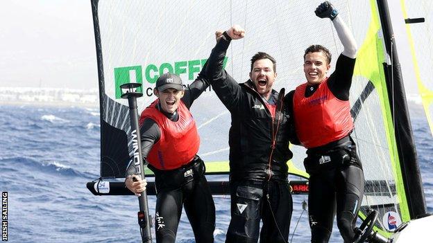 Robert Dickson (left) and Sean Waddilove (right) celebrate with coach Matt McGovern