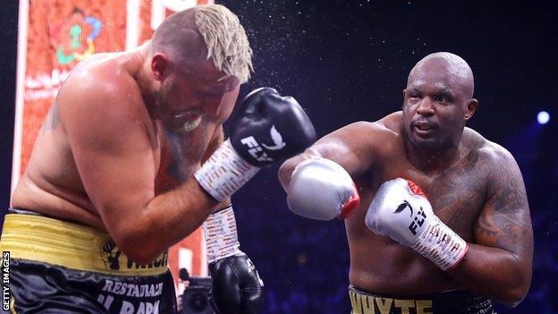 British heavyweight Dillian Whyte (right) lands a punch on Poland's Mariusz Wach (left) in victory in Saudi Arabia