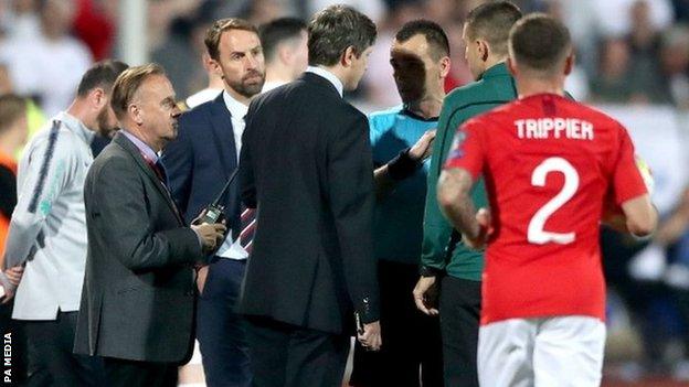 England boss Gareth Southgate speaks to officials during the game in Sofia