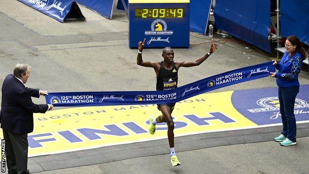 Kenya's Benson Kipruto crosses the line to win the men's race in Boston