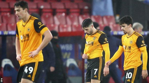 Wolves' players react during a defeat to Crystal Palace in the Premier League