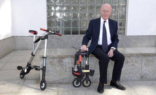 Sir Clive Sinclair with his collapsible bike