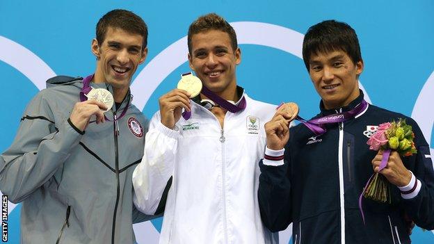 Chad Le Clos (centre) celebrates with his gold medal in the Men's 200m Butterfly alongside Silver medallist Michael Phelps of the United States and bronze medallist Takeshi Matsuda of Japan at London 2012