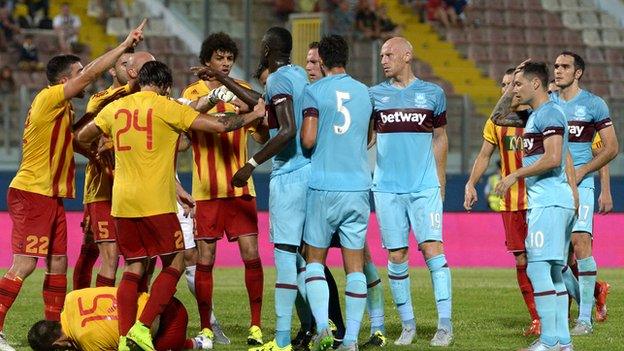 Birkirkara and West Ham players tussle during the match