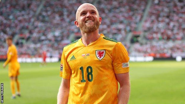 Jonny Williams celebrates scoring for Wales