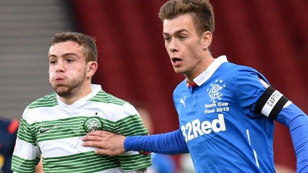 Celtic's Paul McMullan battles with Rangers' Ryan Sinammon