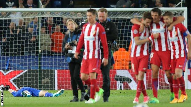 Atletico players celebrate in front of Jamie Vardy (laid out on the pitch)