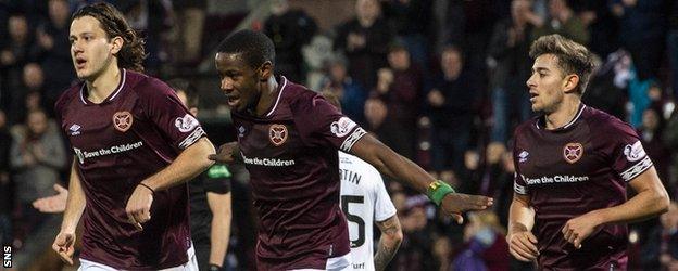 Arnaud Djoum, centre, doubled Hearts' advantage