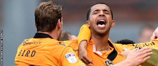 Newport captain Joss Labadie celebrates scoring the winner against Crewe