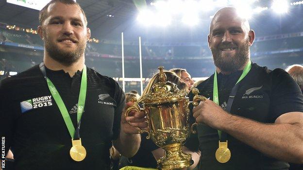 Ben Franks (right) holding the Rugby World Cup trophy with brother Owen