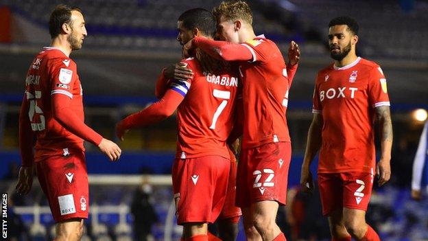 Nottingham Forest players celebrate with Lewis Grabban