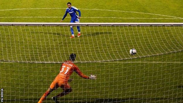 Trae Coyle struck Gillingham's winning penalty in the shoot-out to earn a third-round trip to either Wolves or Stoke