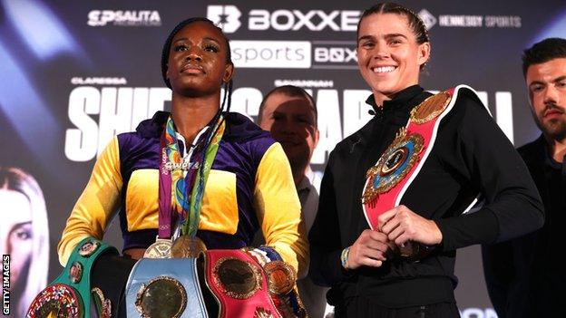 Savannah Marshall grins posing beside Claressa Shields