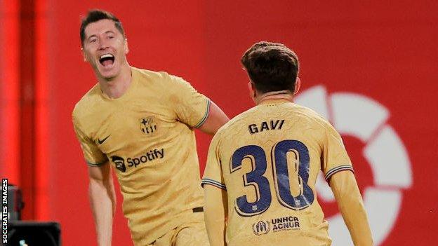 Robert Lewandowski celebrates scoring