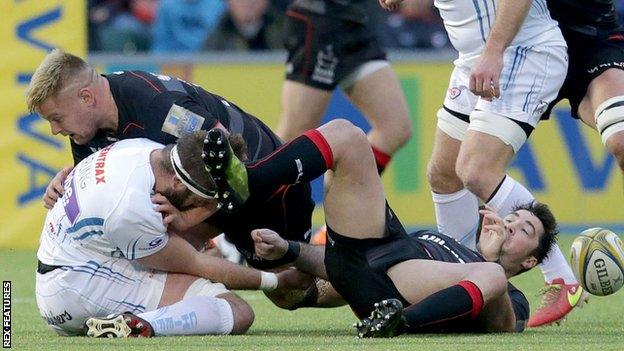 Richard Barrington and Brad Barritt (right) tackle Geoff Parling