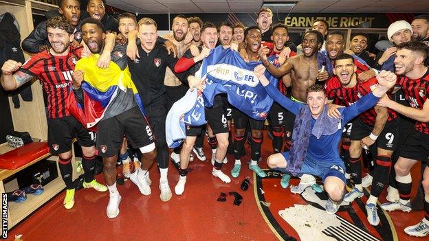 Bournemouth players celebrate their promotion to the Premier League