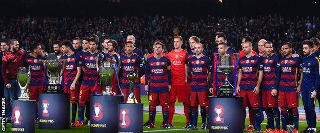 Barcelona's players lined up for a team photograph before kick-off with the five trophies the club won in 2015