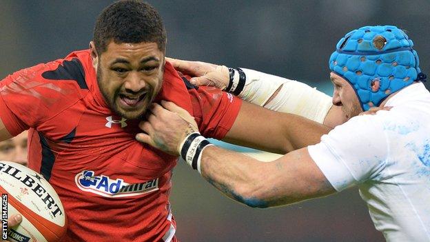 Taulupe Faletau takes on England's James Haskell in the 2015 Six Nations