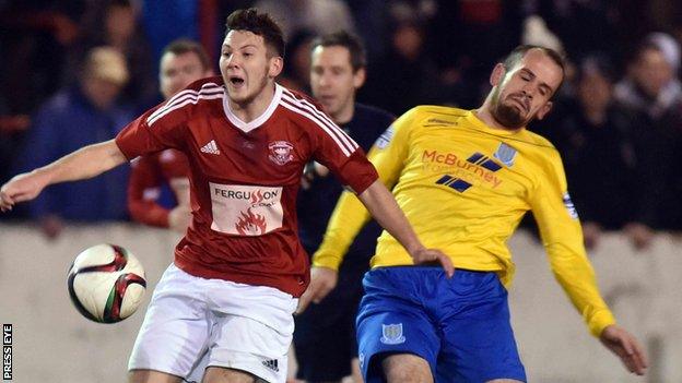 Larne's John Donnelly battles with Ballymena's Tony Kane at Inver Park