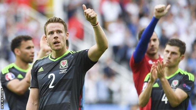 Chris Gunter salutes the 'Red Wall' of Wales fans during Euro 2016