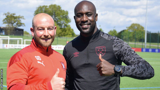 Romulus academy manager and Hednesford Town assistant boss Graham Deakin (left) with former West Ham and England forward Carlton Cole