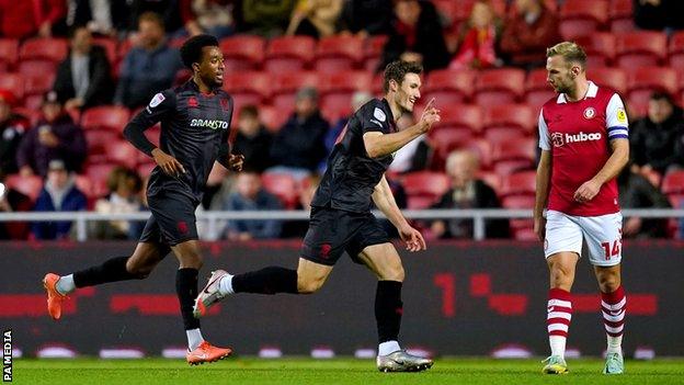 Lincoln City's Matty Virtue (centre) celebrates scoring their side's first goal of the game against Bristol City in the EFL Cup