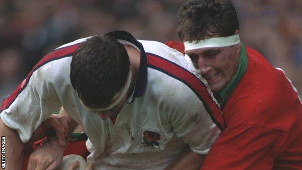 Emyr Lewis (right) tackles England lock in the Five Nations in 1993, a game Wales won 10-9