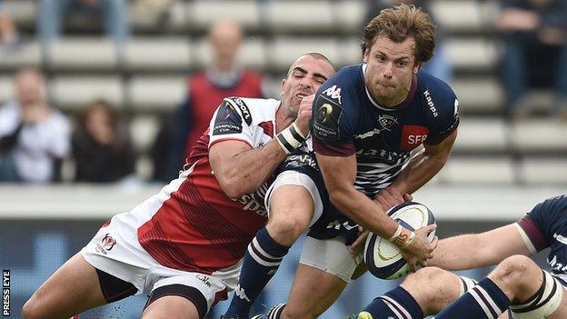 Ruan Pienaar grimaces as he tackles Bordeaux's Yann Lesgourgues in Sunday's game