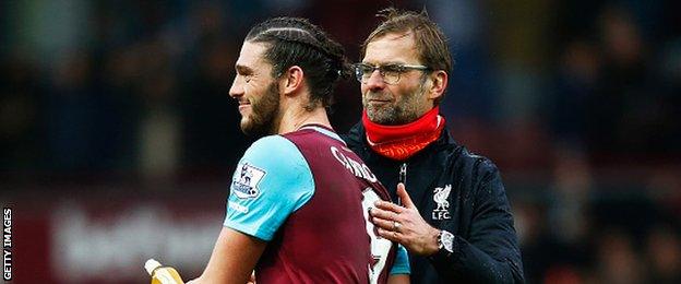 West Ham United striker Andy Carroll (left) with Liverpool manager Jurgen Klopp