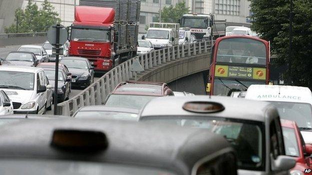 A London bus is seen in a traffic jam near a junction of the A40 in London