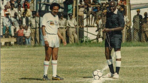 The late Kenneth Kaunda (left) set to referee a football match