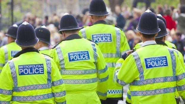 Police officers in high-visibility coats