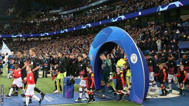 Manchester City walk out to play at the Etihad