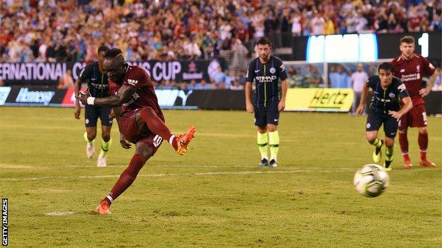 Sadio Mane scores a penalty for Liverpool against Manchester City