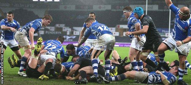 Dragons number eight Ed Jackson scores a try to give his side late hope