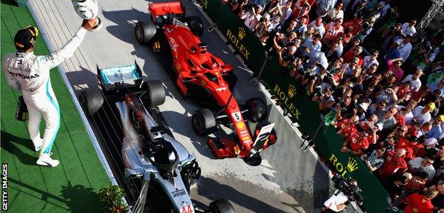 Lewis Hamilton celebrates winning the Hungarian Grand Prix on the podium