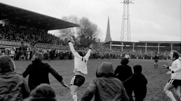 Ronnie Radford turns towards the old Blackfriars End after the Bulls' finest moment - his famous FA Cup thunderbolt against Newcastle United at Edgar Street in 1972