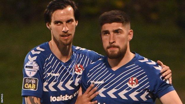 Declan Caddell consoles a dejected Michael Ruddy after the shootout defeat by Cliftonville