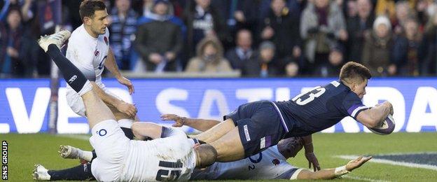 Scotland centre Huw Jones crashes through to score his second try of the game