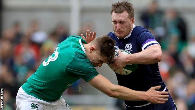 Scotland full-back Stuart Hogg tries to fend off Ireland centre Garry Ringrose