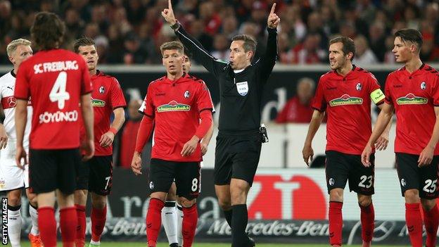 Freiburg's Caglar Soyuncu (left) was sent off after 12 minutes for a handball during his team's 3-0 defeat by Stuttgart