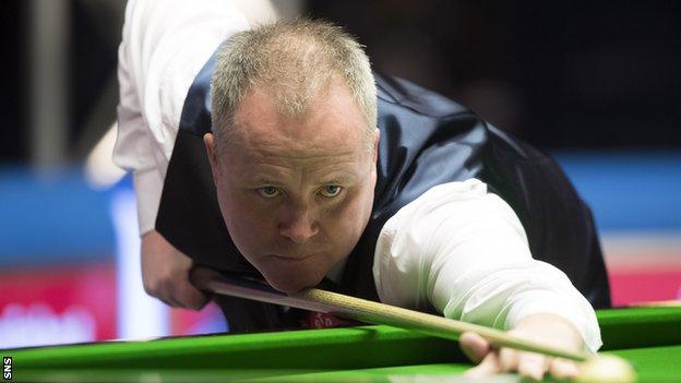 John Higgins plays a pot against Christopher Keogan