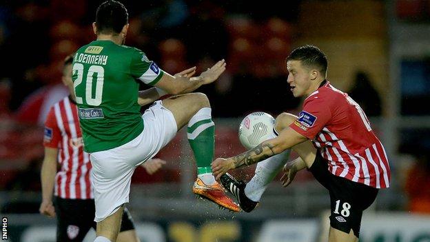 Cork's Billy Dennehy challenges Derry opponent Rob Cornwall