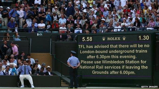 An electronic board warns of a pending tube strike during day nine of the Wimbledon Lawn Tennis Championships at the All England Lawn Tennis and Croquet Club