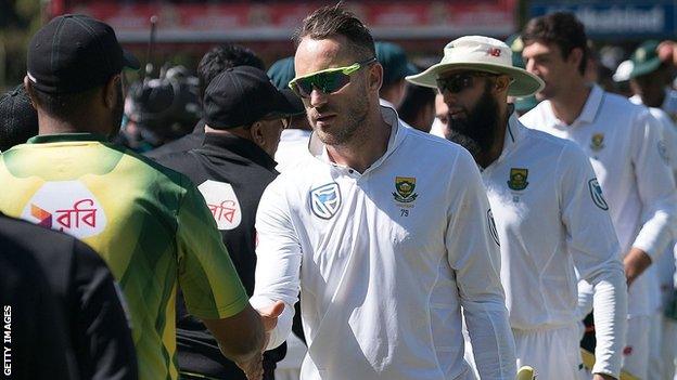 Bangladesh and South Africa's players shake hands after the Test series