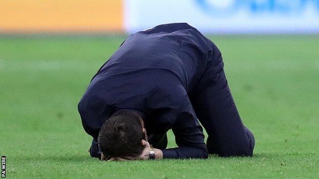 Mauricio Pochettino falls to his knees at the final whistle