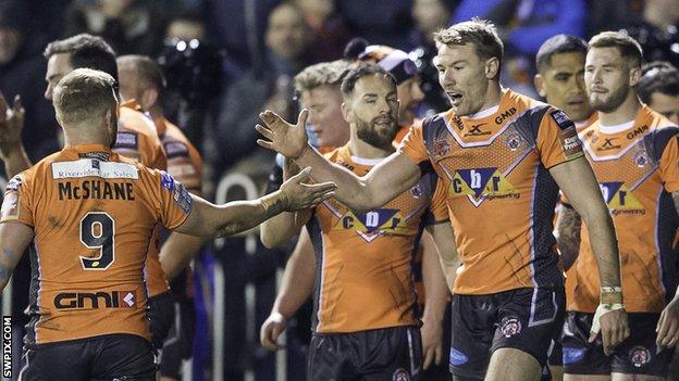 Castleford players celebrate a try